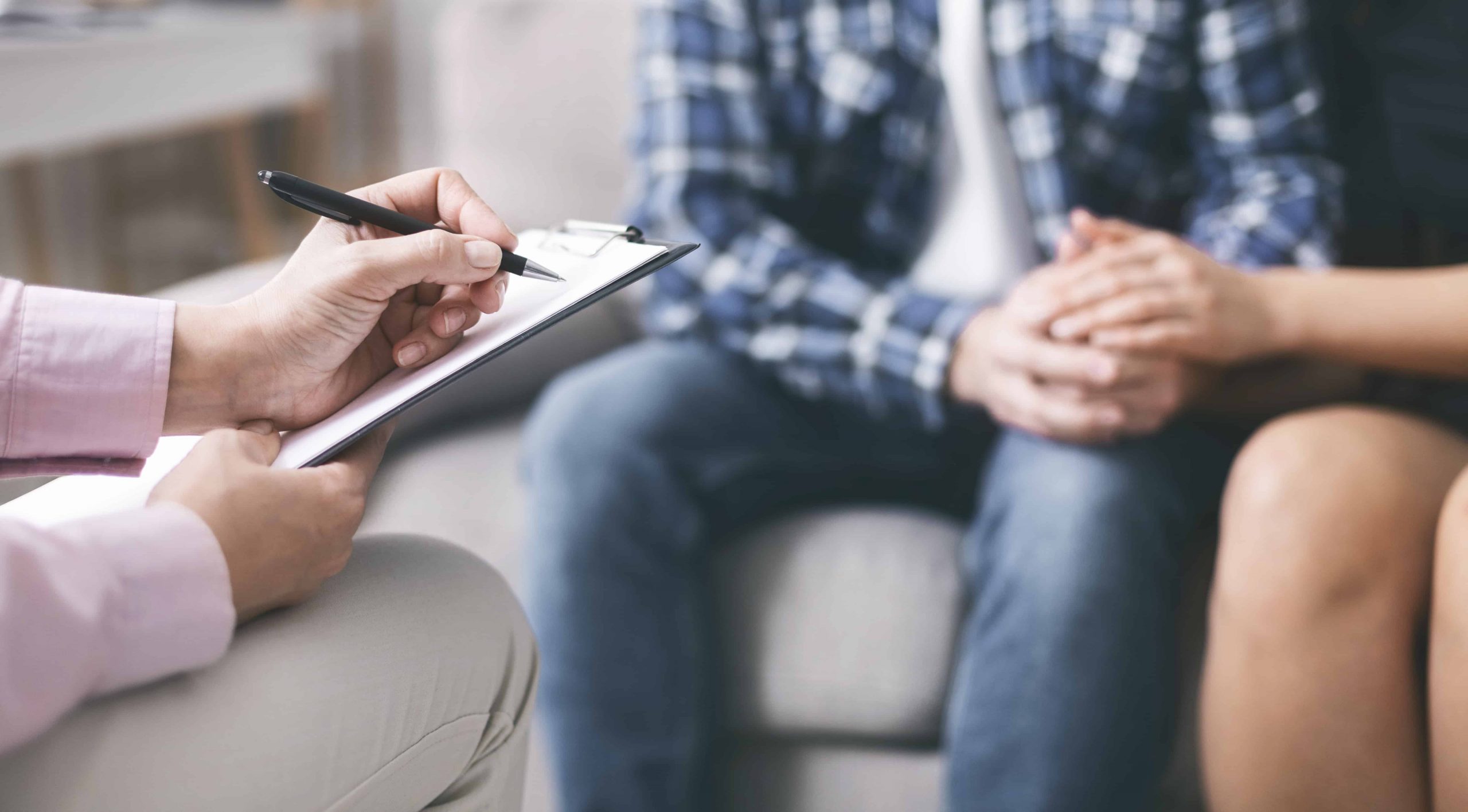 Man and woman support each other throughout Assisted Reproductive Therapy doctor appointment